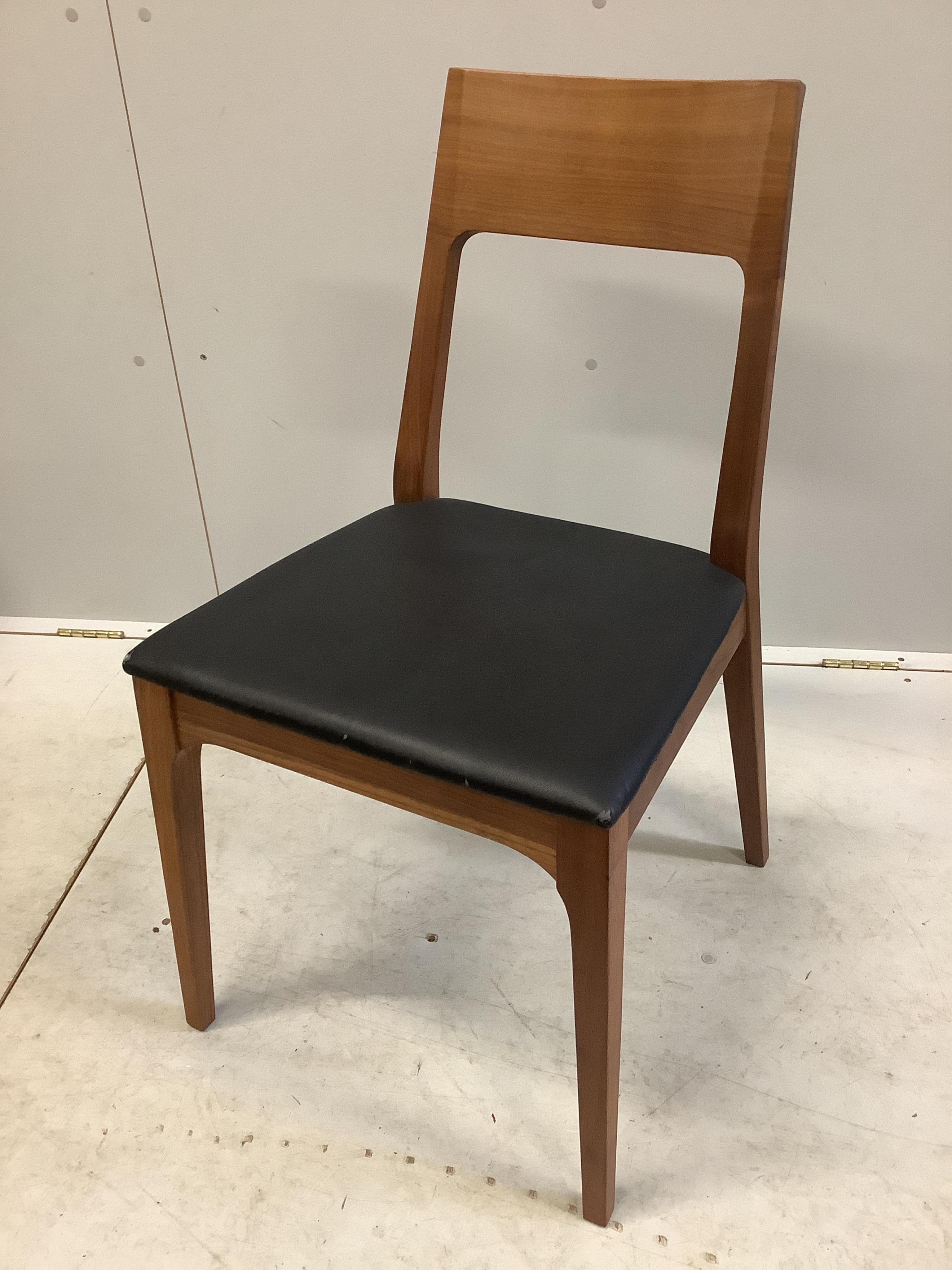 A Contemporary American black walnut dining table and ten chairs, by Chartwood designs Ltd, width 300cm, depth 120cm, height 75cm. Condition - fair